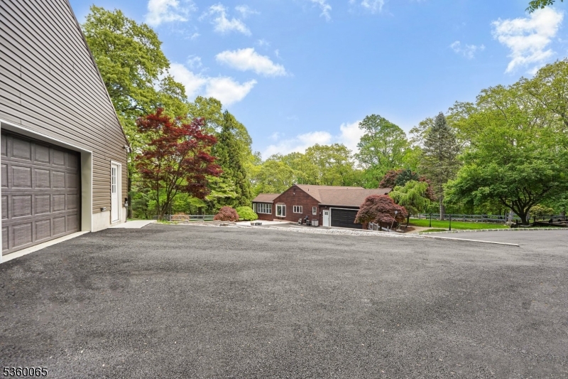 26 Danville Mountain Road Great Meadows, NJ 07838 - Photo 8 of 49 a front view of a house with a yard and garage