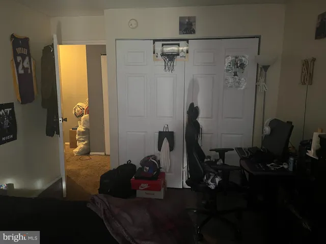 a white toilet sitting next to a shower curtain