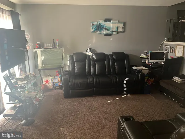 a view of a livingroom with furniture and window