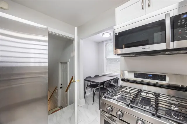 a kitchen with a stove and a microwave