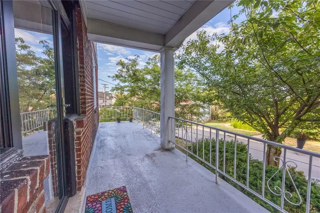 a view of a porch with wooden floor and outdoor space