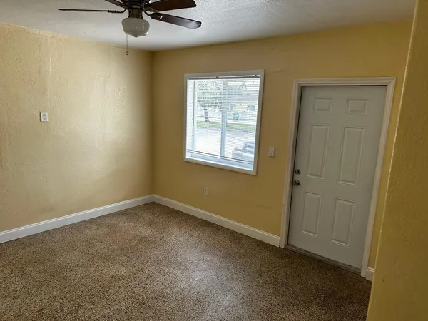 a view of a room that has a window in it