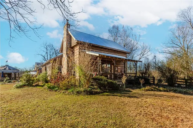 a view of house with yard