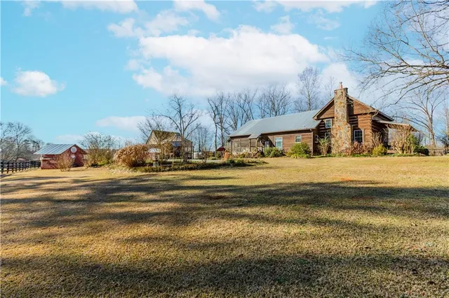 a view of houses with snow on the road
