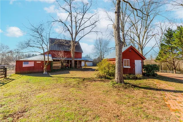 a view of a house with a yard covered with snow in the yard