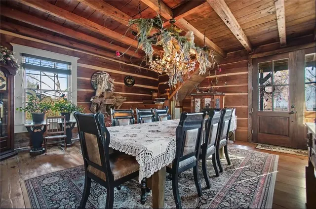 a view of a dining room with furniture and window