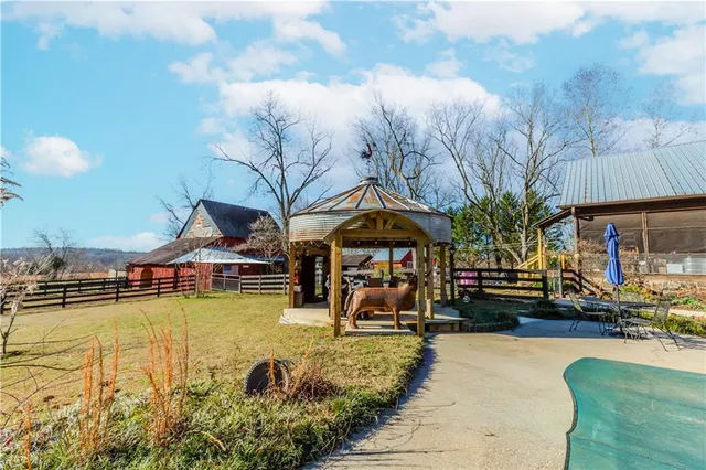 a view of a swimming pool with a patio