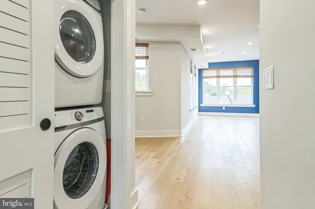 a view of a hallway with washer and dryer