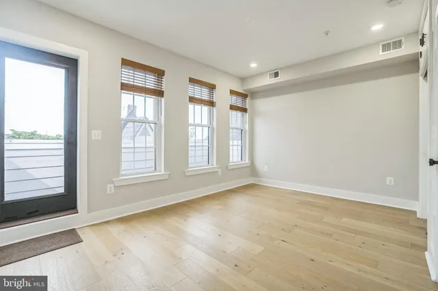 a view of an empty room with a window
