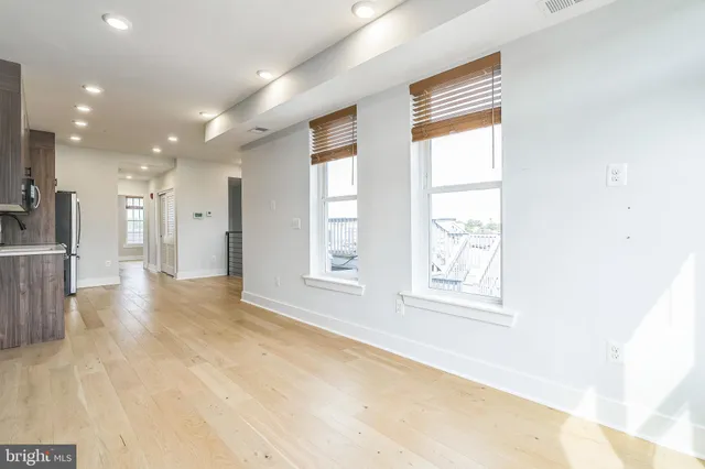 a view of an empty room with a window