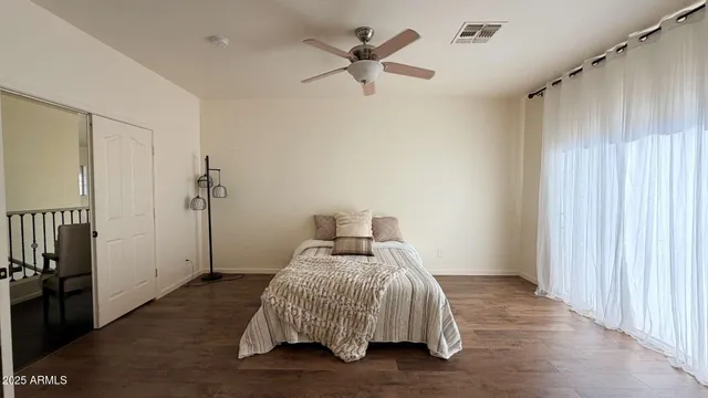 a view of a living room with furniture and a window