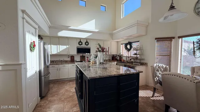a kitchen with counter top space and stainless steel appliances