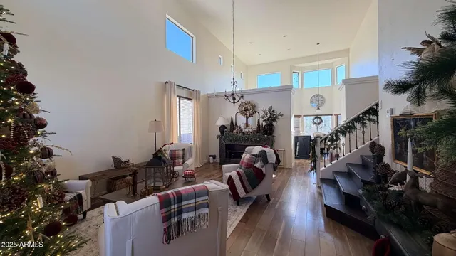 a view of a living room with furniture and wooden floor