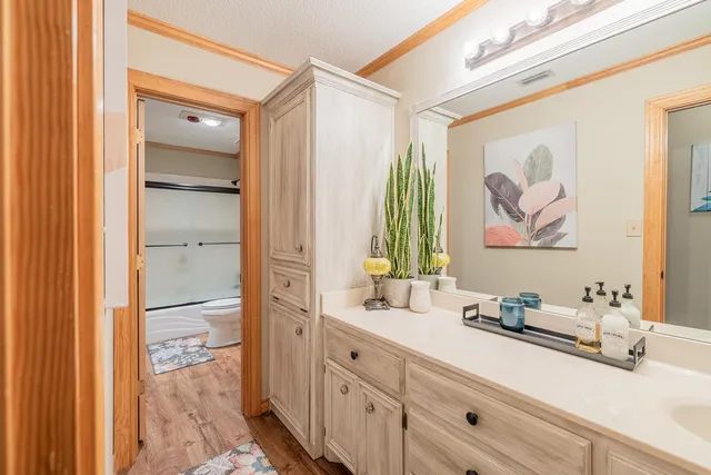 a bathroom with a double vanity sink and a mirror