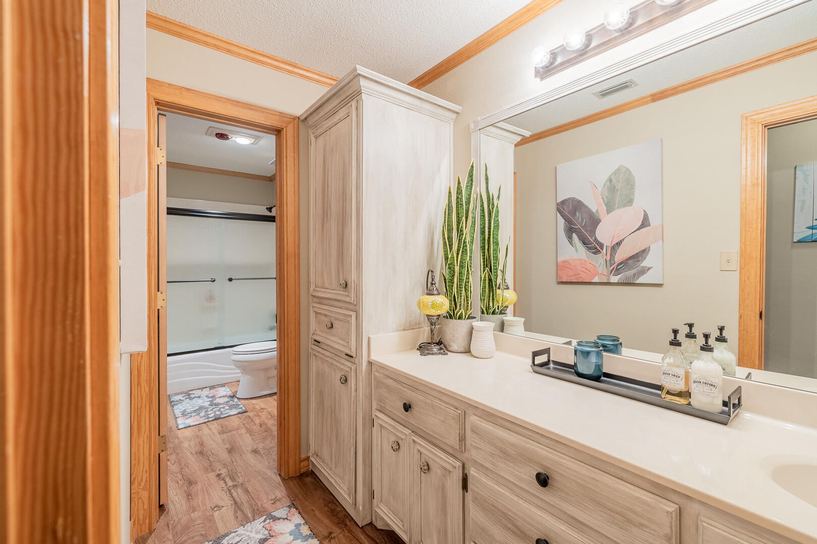 1005 N Avenue South Post, TX 79356 - Photo 11 of 49 a bathroom with a double vanity sink and a mirror