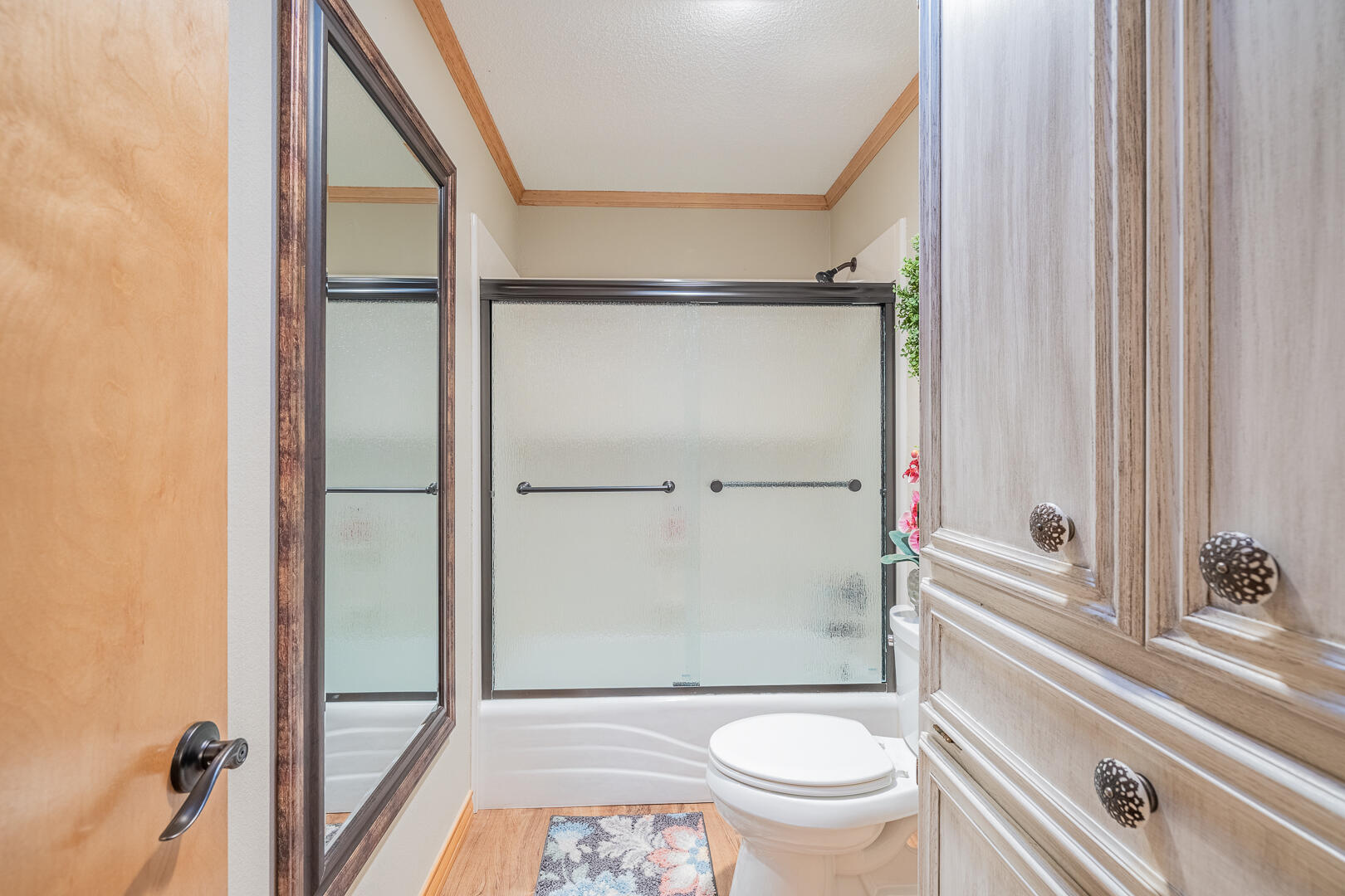 1005 N Avenue South Post, TX 79356 - Photo 12 of 49 a bathroom with a granite countertop window a toilet and a shower