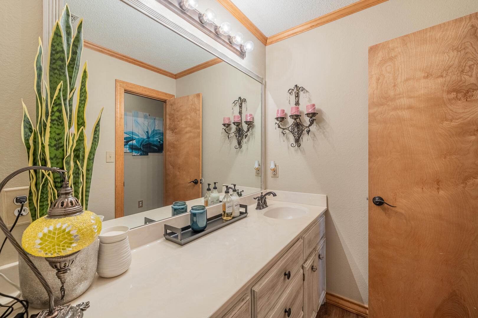 1005 N Avenue South Post, TX 79356 - Photo 13 of 49 a bathroom with a granite countertop sink a toilet and mirror