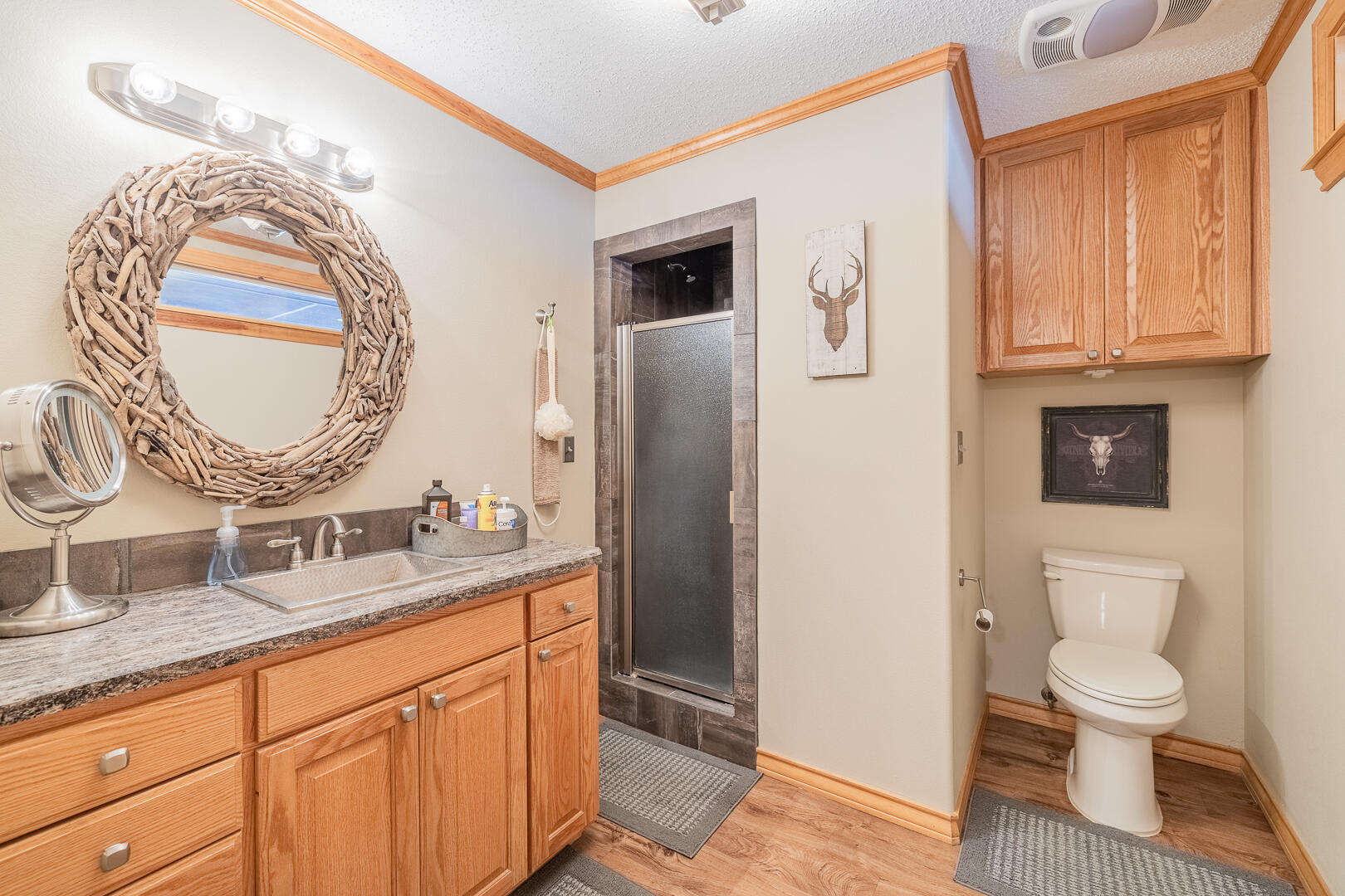 1005 N Avenue South Post, TX 79356 - Photo 18 of 49 a bathroom with a granite countertop toilet sink and mirror