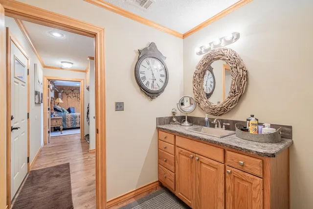 a spacious bedroom with a bed and a couch