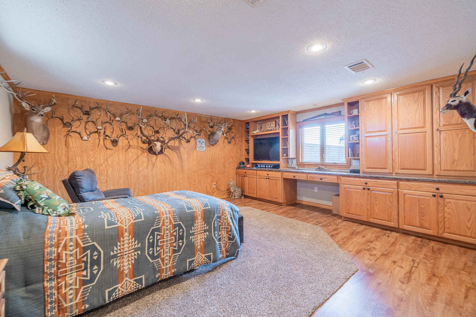 1005 N Avenue South Post, TX 79356 - Photo 20 of 49 a large bedroom with a large bed and wooden floor