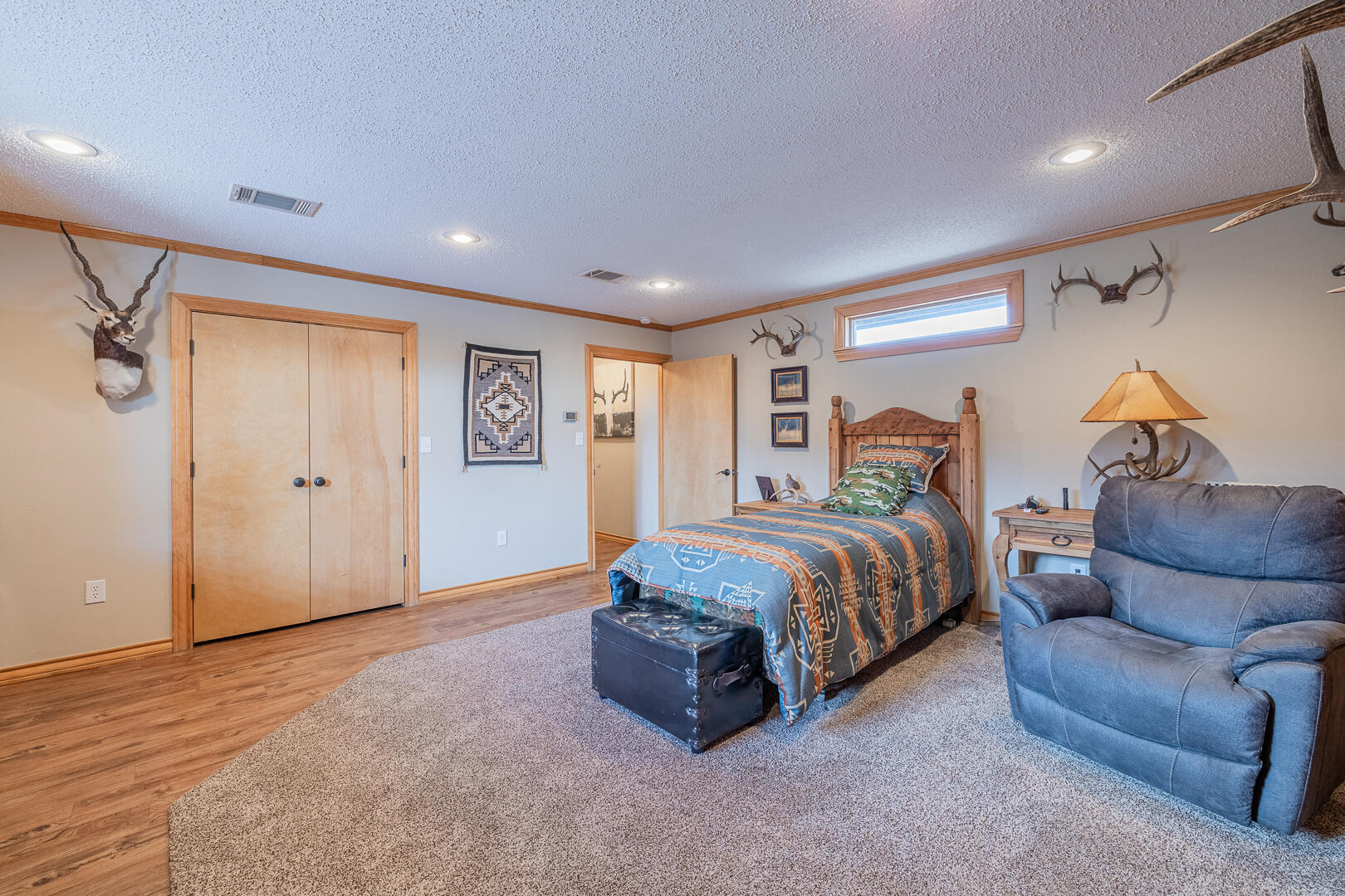1005 N Avenue South Post, TX 79356 - Photo 21 of 49 a spacious bedroom with a bed and a couch