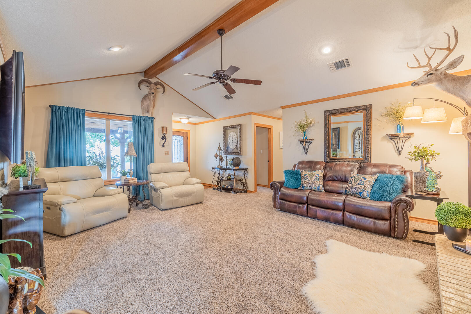 1005 N Avenue South Post, TX 79356 - Photo 23 of 49 a living room with furniture a chandelier and a chandelier