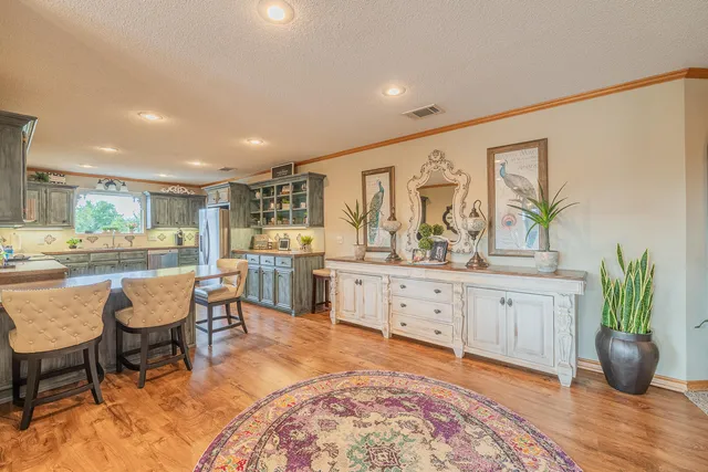 a kitchen with stainless steel appliances granite countertop a sink and cabinets