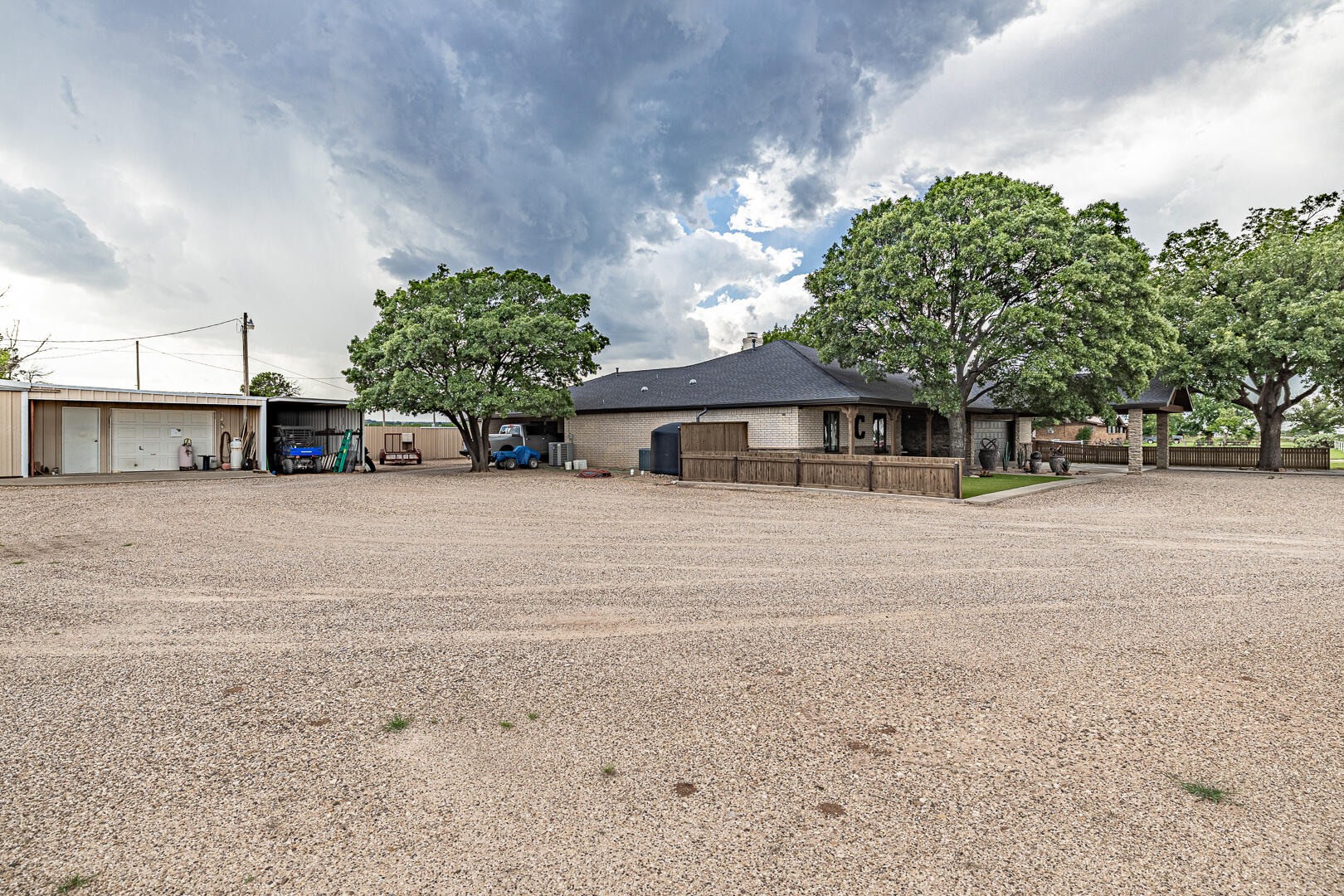 1005 N Avenue South Post, TX 79356 - Photo 4 of 49 a front view of a house with a yard and garage
