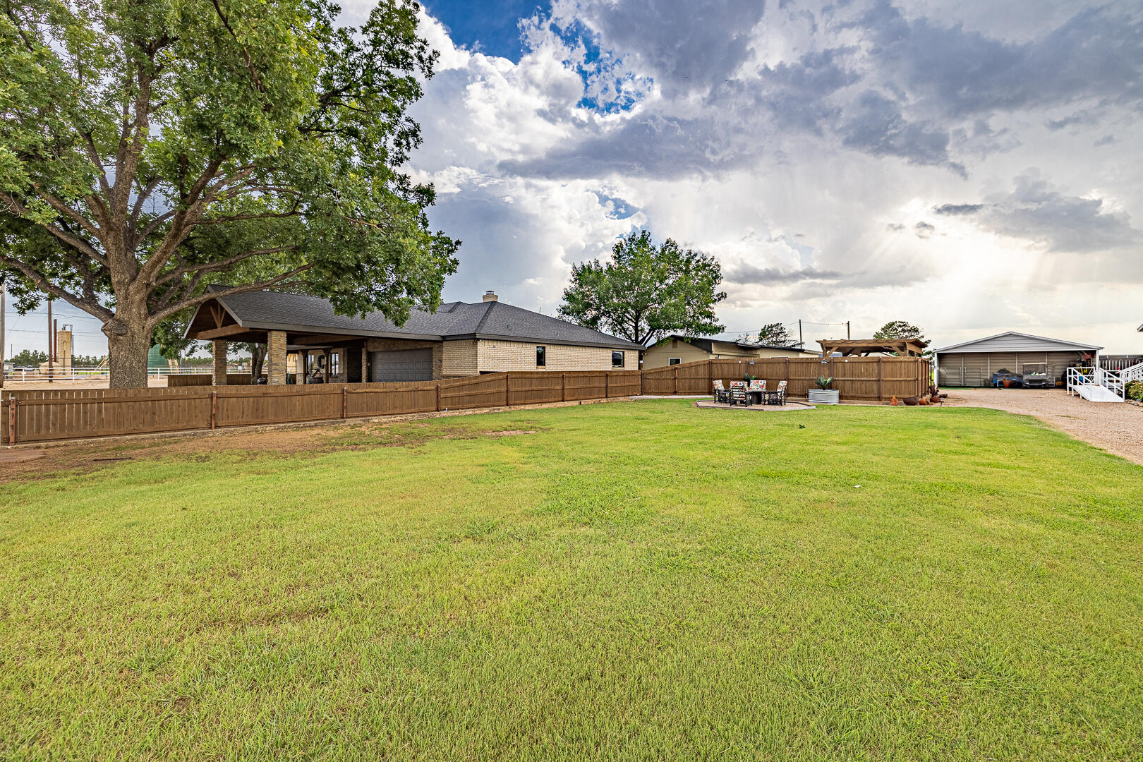 1005 N Avenue South Post, TX 79356 - Photo 7 of 49 a view of a house with a big yard and large trees