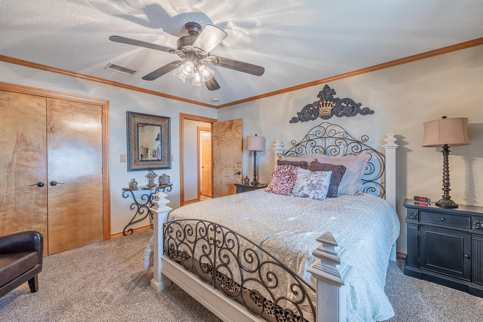 1005 N Avenue South Post, TX 79356 - Photo 10 of 49 a bedroom with a bed and a chandelier