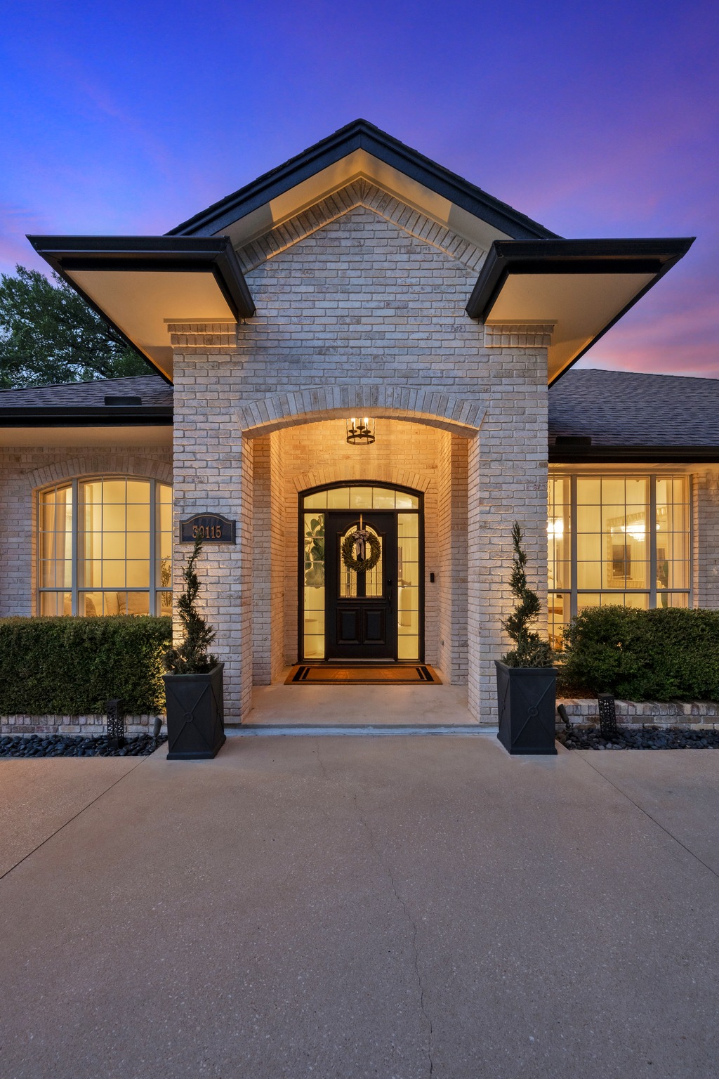 30115 Sawgrass Trail Georgetown, TX 78628 - Photo 2 of 37 A welcoming brick facade with an arched entryway invites residents inside.