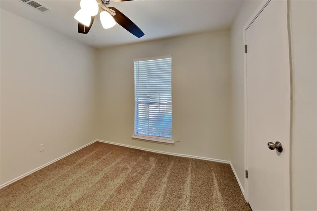 7809 Meadowlark Lane Rowlett, TX 75088 - Photo 12 of 18 a view of an empty room with a window