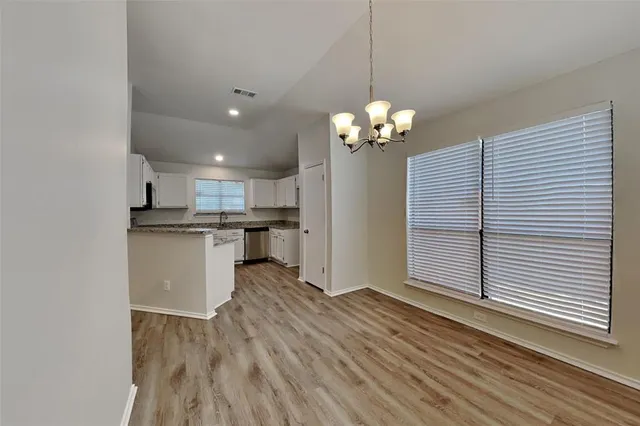 a view of a kitchen with electric appliances