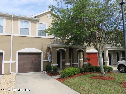 12958 Spring Rain Road Jacksonville, FL 32258 - Photo 1 of 18 a front view of a house with a yard and garage