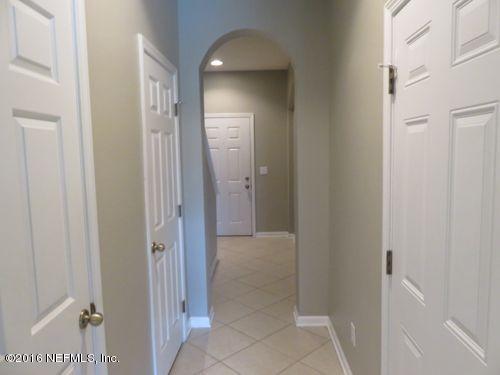 12958 Spring Rain Road Jacksonville, FL 32258 - Photo 6 of 18 a view of a hallway with a wooden cabinets