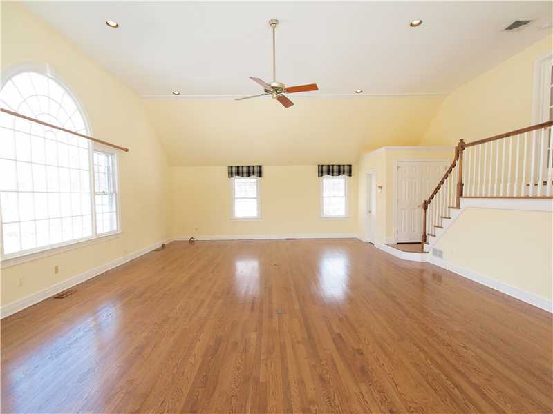 Undisclosed Address Darien, CT 06820 - Photo 14 of 19 a view of empty room with wooden floor and fan