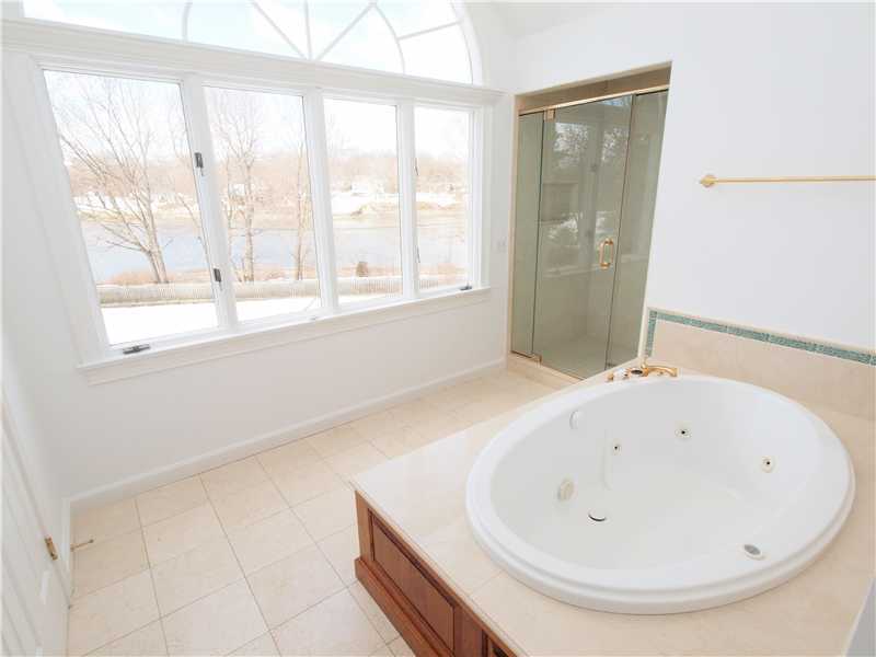 Undisclosed Address Darien, CT 06820 - Photo 16 of 19 a bathroom with a bathtub and a window