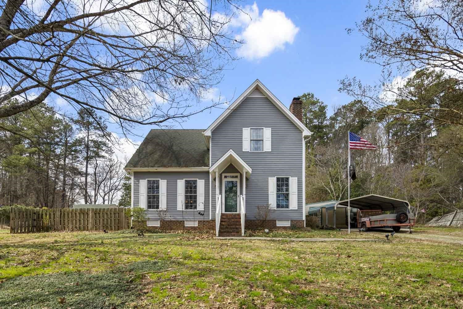 2109 Howson Road Raleigh, NC 27603 - Photo 1 of 36 a view of a house with a yard