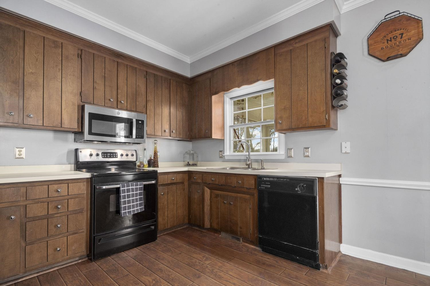 2109 Howson Road Raleigh, NC 27603 - Photo 13 of 36 a kitchen with a sink stove and microwave