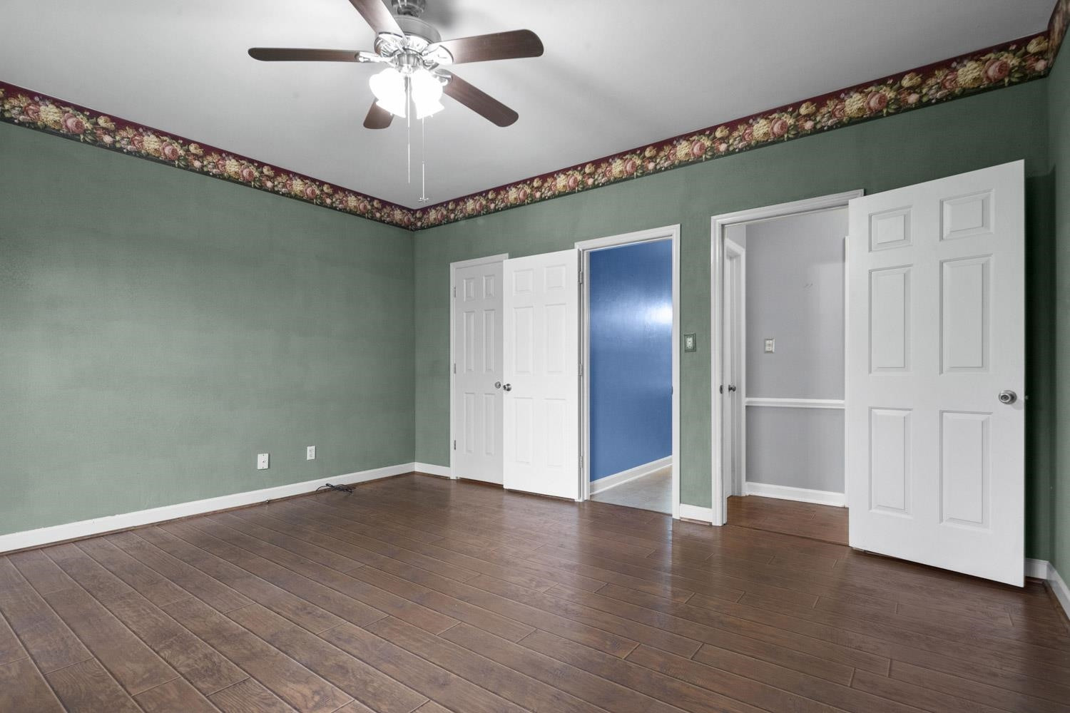 2109 Howson Road Raleigh, NC 27603 - Photo 17 of 36 a view of an empty room with wooden floor
