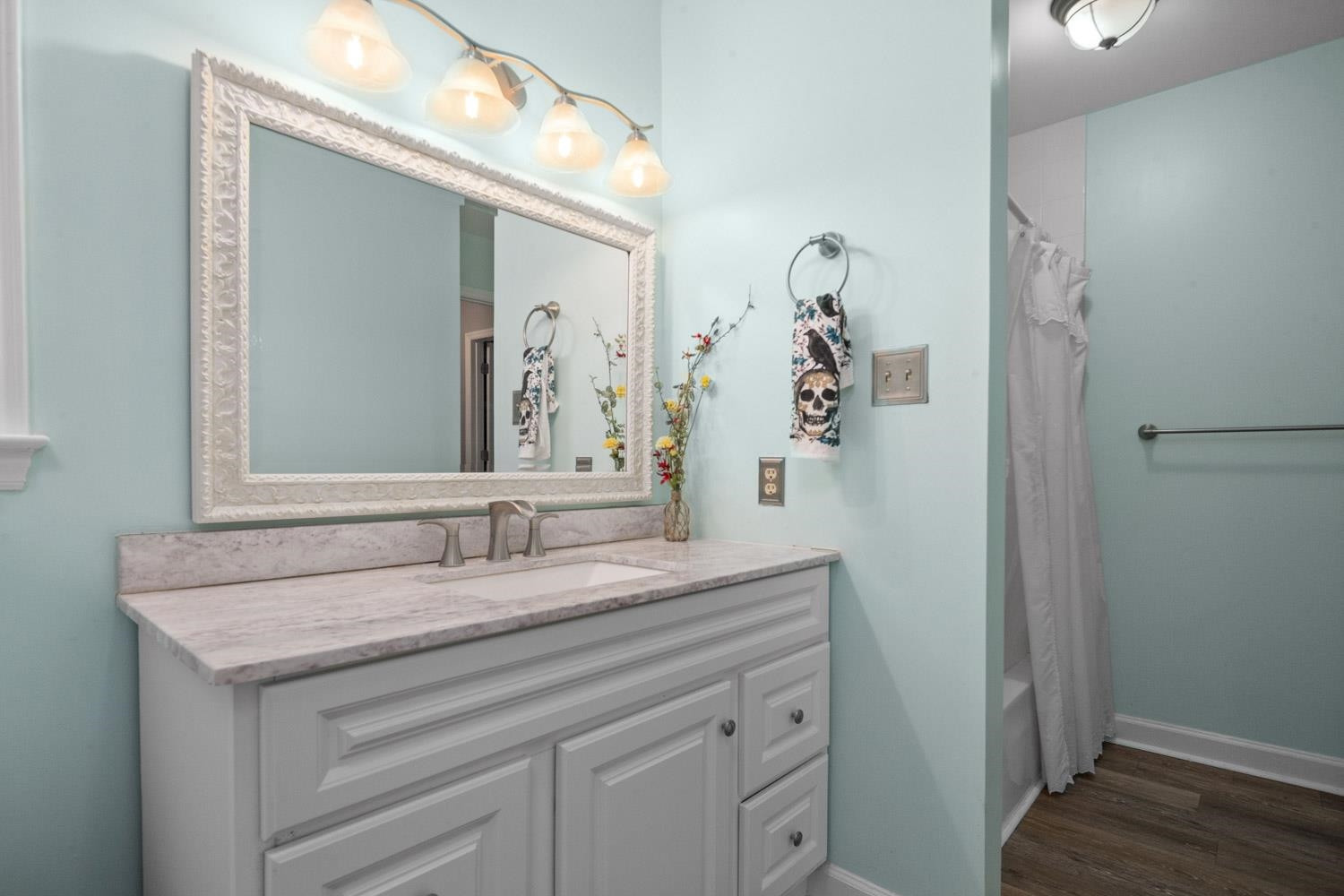 2109 Howson Road Raleigh, NC 27603 - Photo 26 of 36 a bathroom with a sink and a mirror