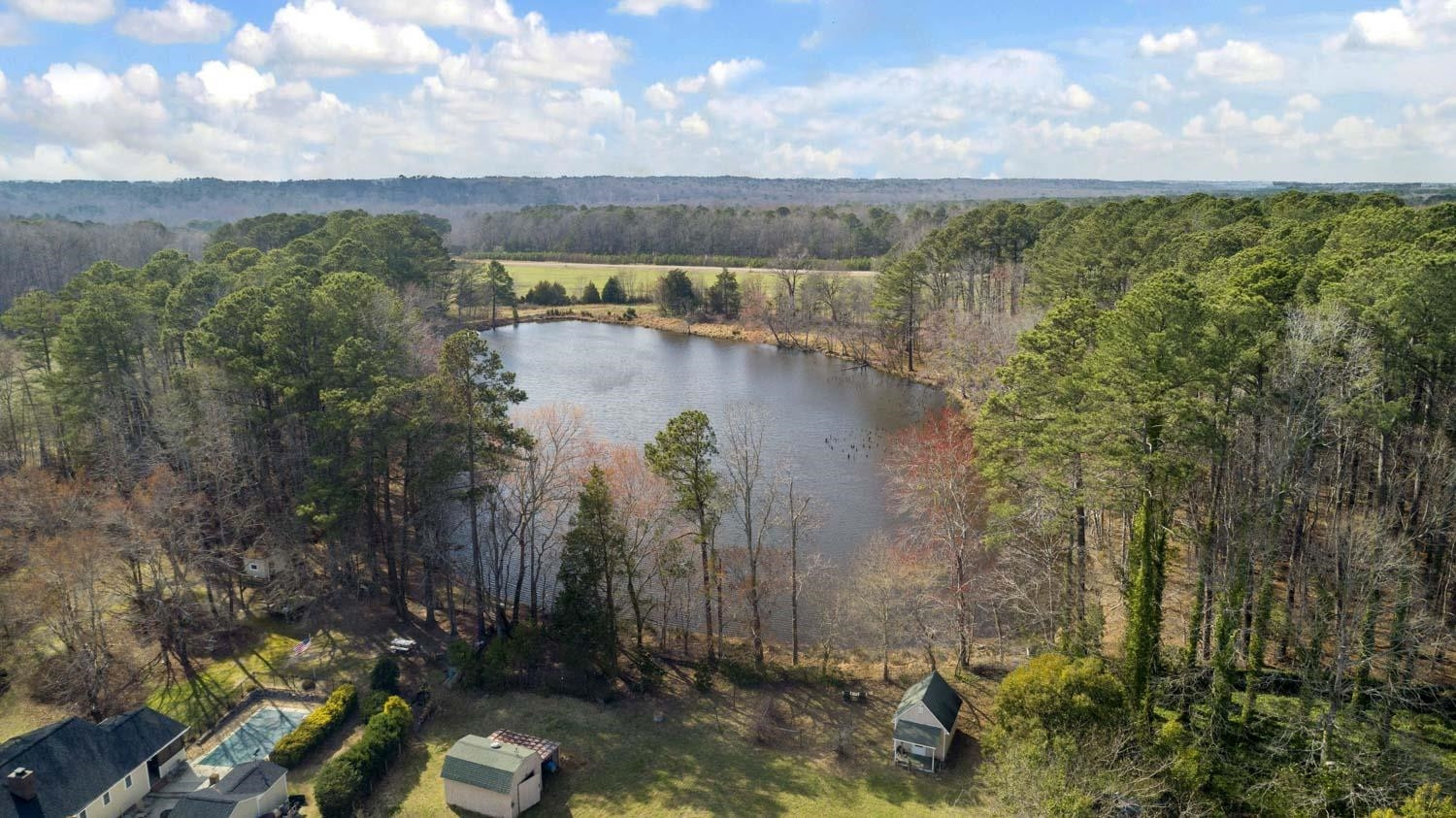 2109 Howson Road Raleigh, NC 27603 - Photo 35 of 36 a view of a lake with a yard