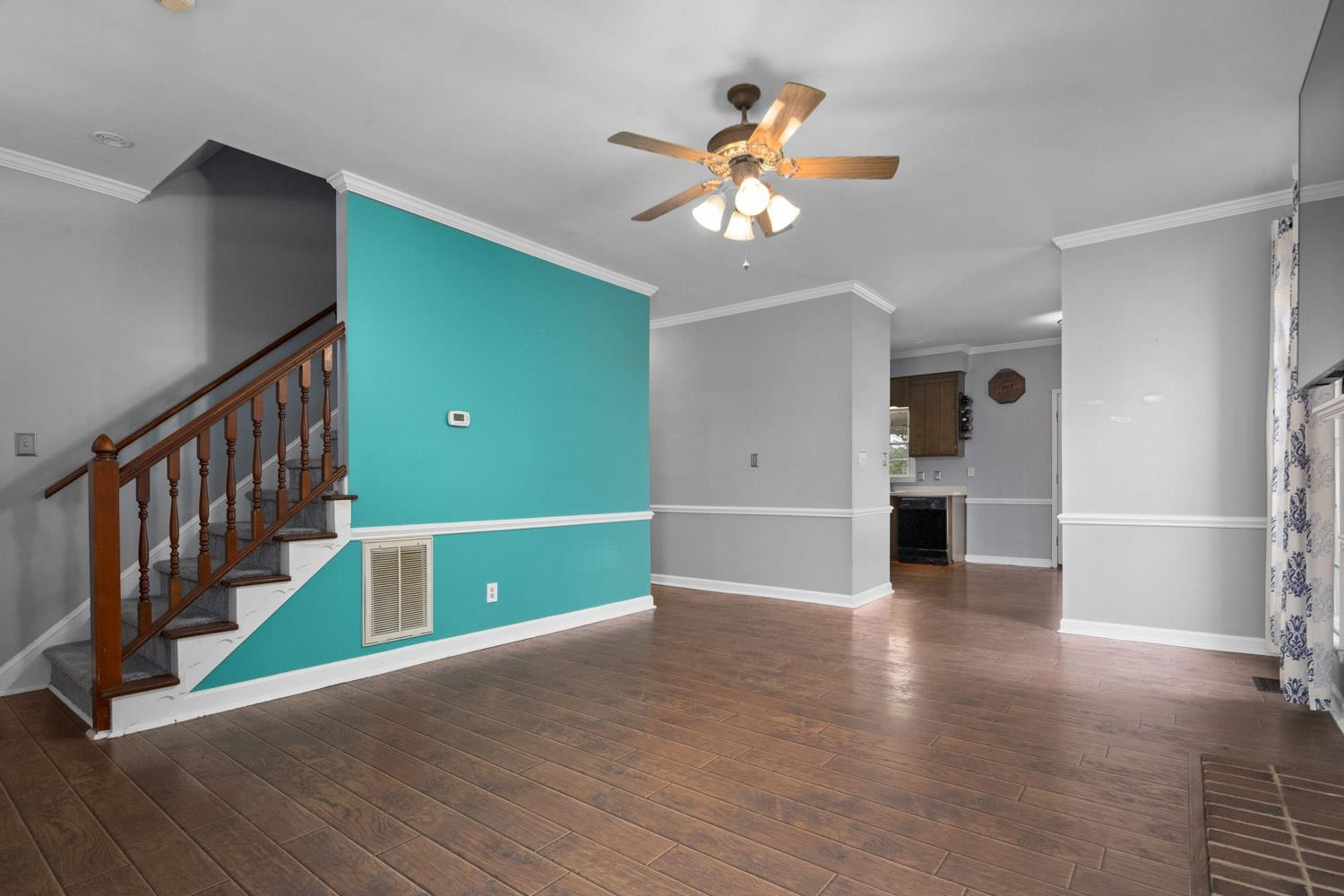 2109 Howson Road Raleigh, NC 27603 - Photo 9 of 36 a view of an empty room with a window and wooden floor