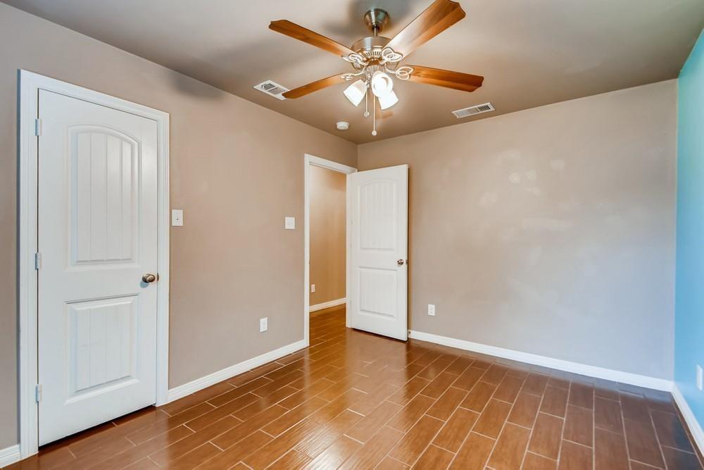 713 Rike Street McKinney, TX 75069 - Photo 20 of 29 a view of an empty room with wooden floor