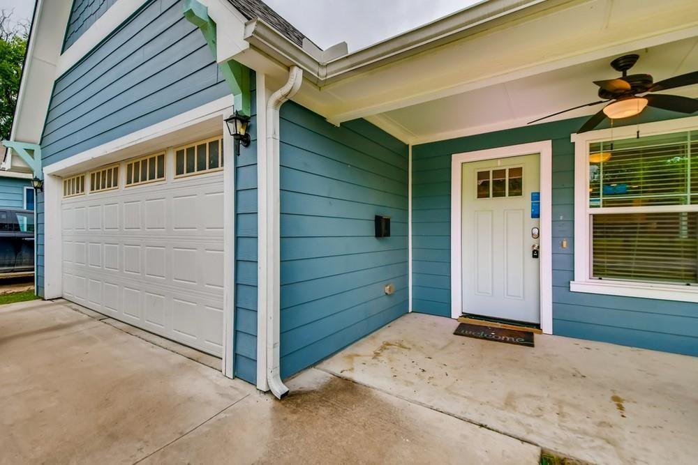 713 Rike Street McKinney, TX 75069 - Photo 26 of 29 a view of front door and a garage