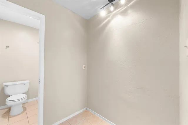 a bathroom with a toilet and a vanity