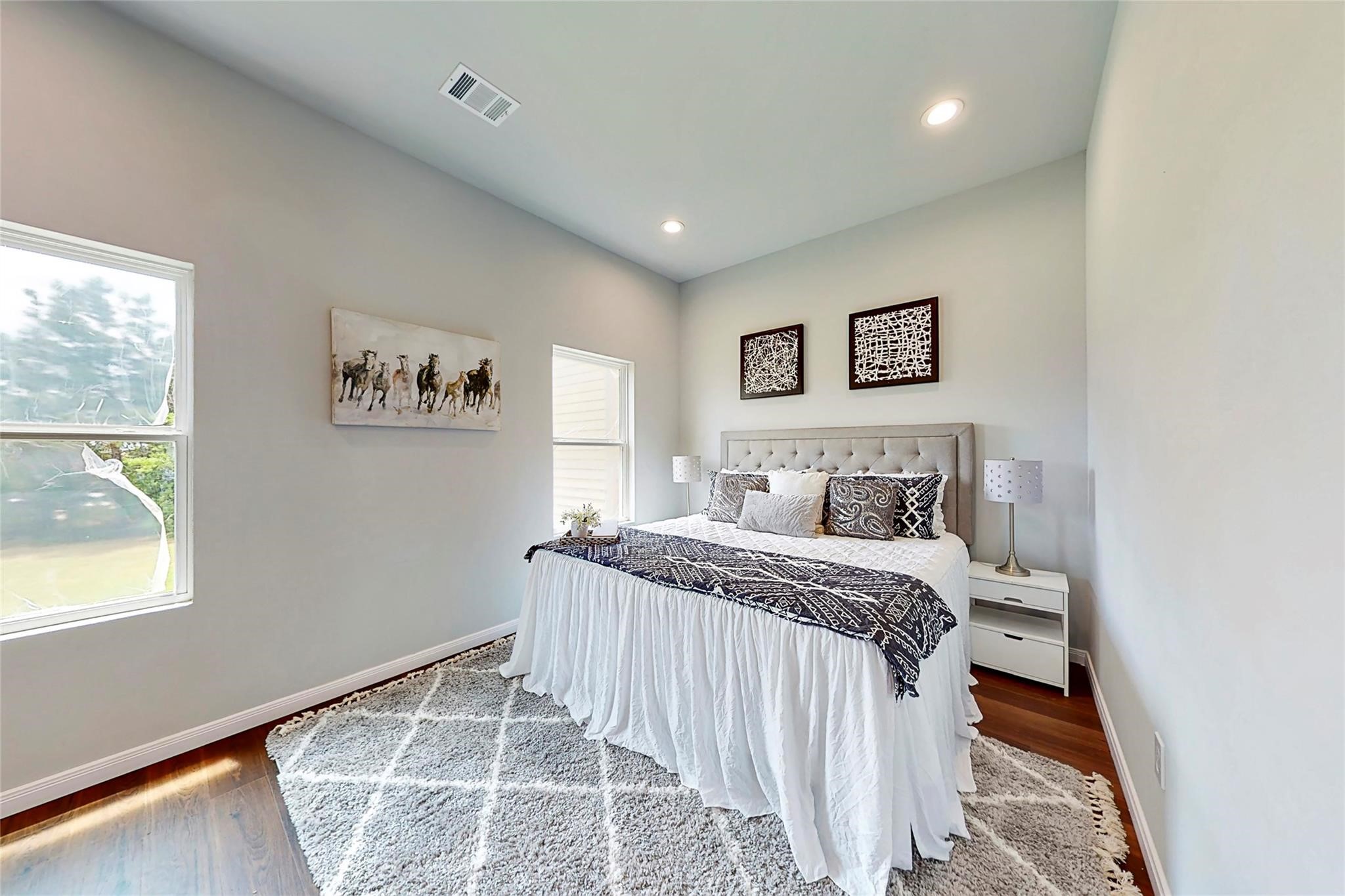 18813 Luminescent Lane Spring, TX 77379 - Photo 12 of 19 a bedroom with a large bed and a window