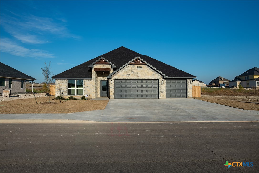 1404 Red Rock Road Hewitt, TX 76643 - Photo 1 of 1 a front view of a house with a yard