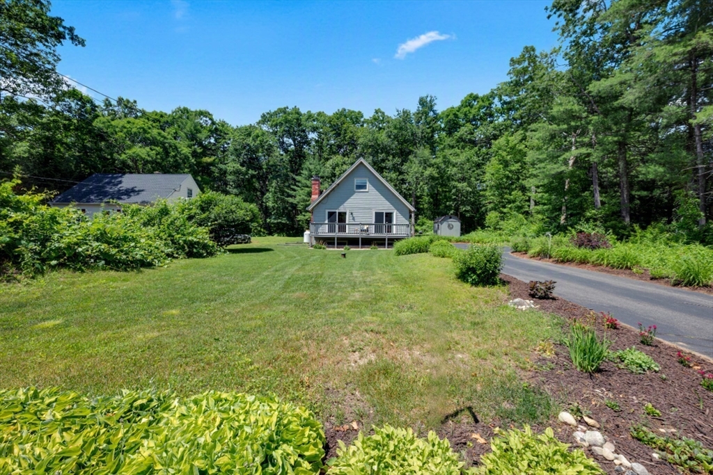 47 Horseshoe Circle Ware, MA 01082 - Photo 1 of 37 a house with green field in front of it