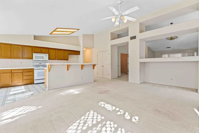 a kitchen with stainless steel appliances granite countertop a sink and a cabinets